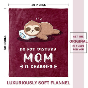 Leebbsin burgundy sloth blanket on sofa, brightens living space with playful design.
