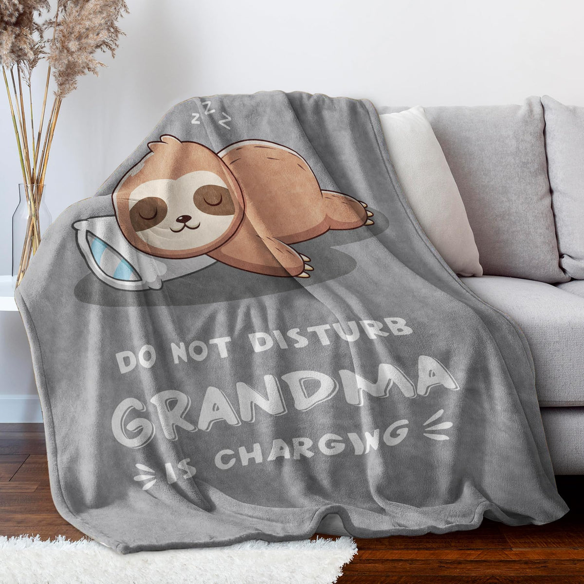Leebbsin grandma charging sloth blanket draped on chair provides instant warmth