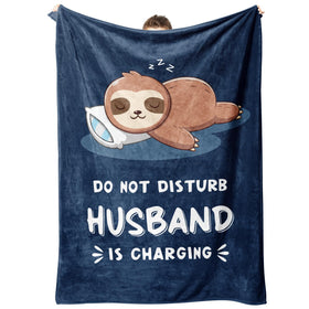 Leebbsin sloth blanket folded on sofa offers warm, relaxing movie-night comfort.