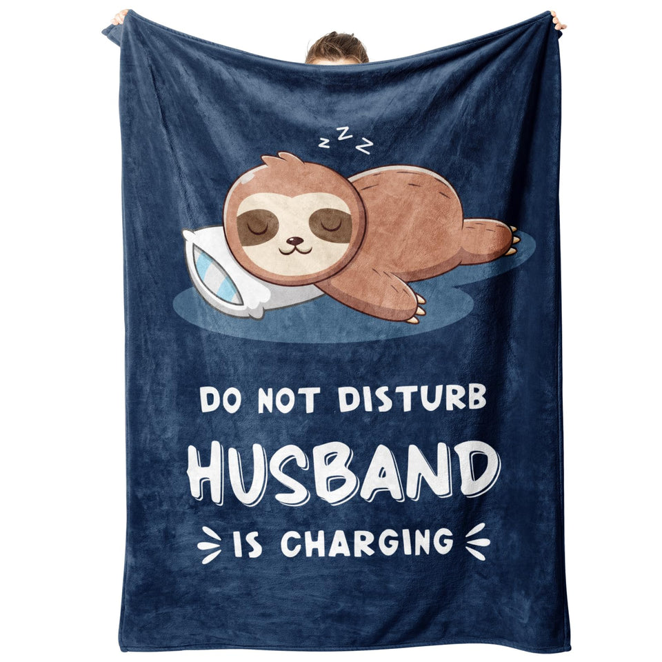 Leebbsin sloth blanket folded on sofa offers warm, relaxing movie-night comfort.