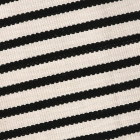 LEEVAN rug lacks rubber backing; pair with a rug pad for grip.
