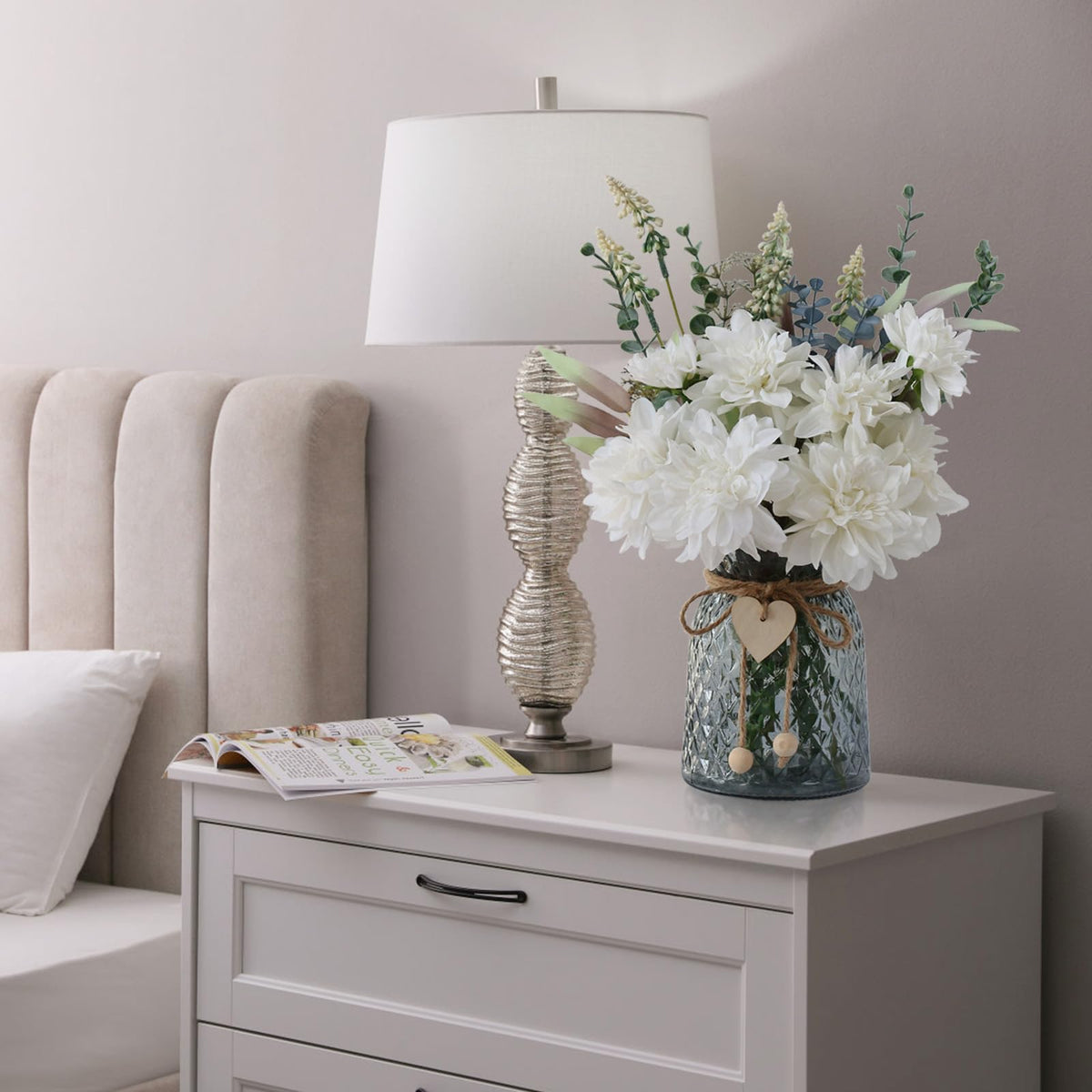 Leftover silk flowers in vase—dahlia bouquet adds living-room charm.