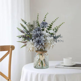 Leftover wooden flower holder provides a natural display.