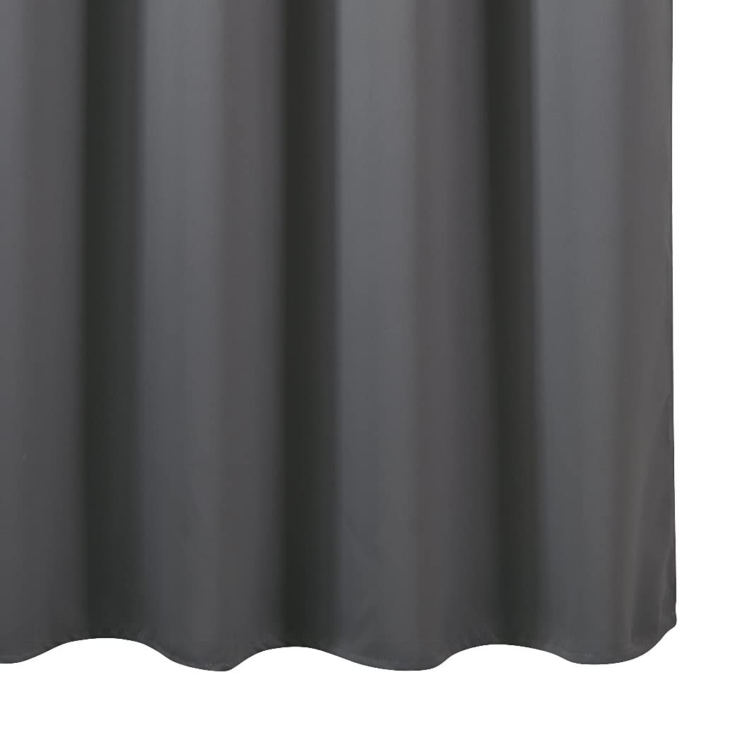 LEMOMO grey blackout curtains in a dim room show dramatic room darkening and cozy atmosphere.