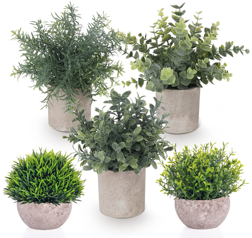 Lemonfilter small-faux-plants-cylindrical-pots brighten compact shelves with maintenance-free greenery.