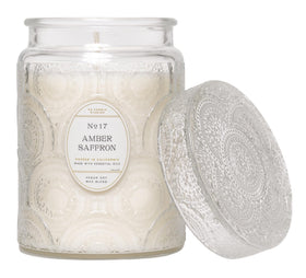 LEOBEN CO Amber Saffron candle with embossed jar adds elegant décor.