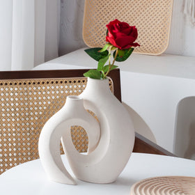 Levvohd hollow ceramic vase dual-piece design adds sculptural elegance to decor.