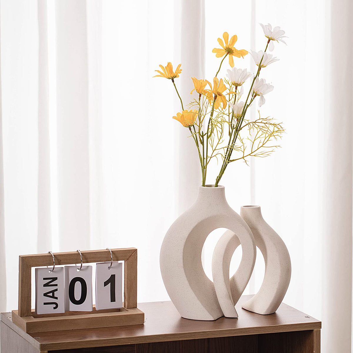 Levvohd hollow ceramic vase short-7in-cream-white complements compact shelves.