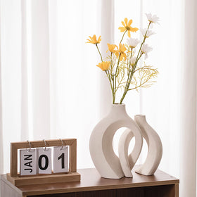 Levvohd hollow ceramic vase short-7in-cream-white complements compact shelves.