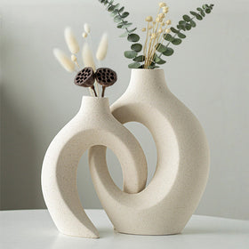 Levvohd hollow ceramic vase tall-8in-cream-white is an ideal centerpiece.