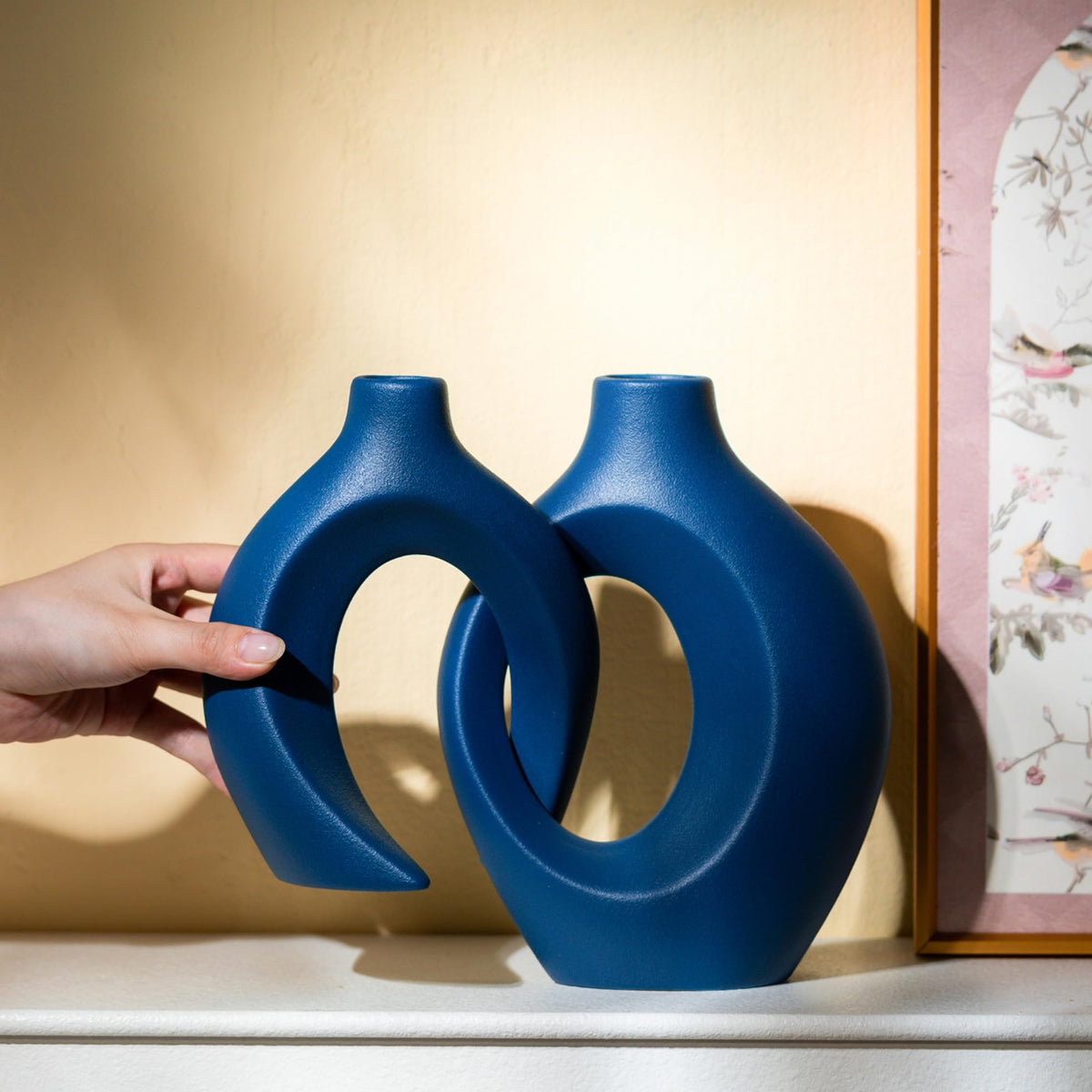 Levvohd Snuggle Hollow navy vases ready for stylish table decor.