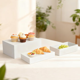 Liengoron food display risers that are lightweight and simple to clean for events.