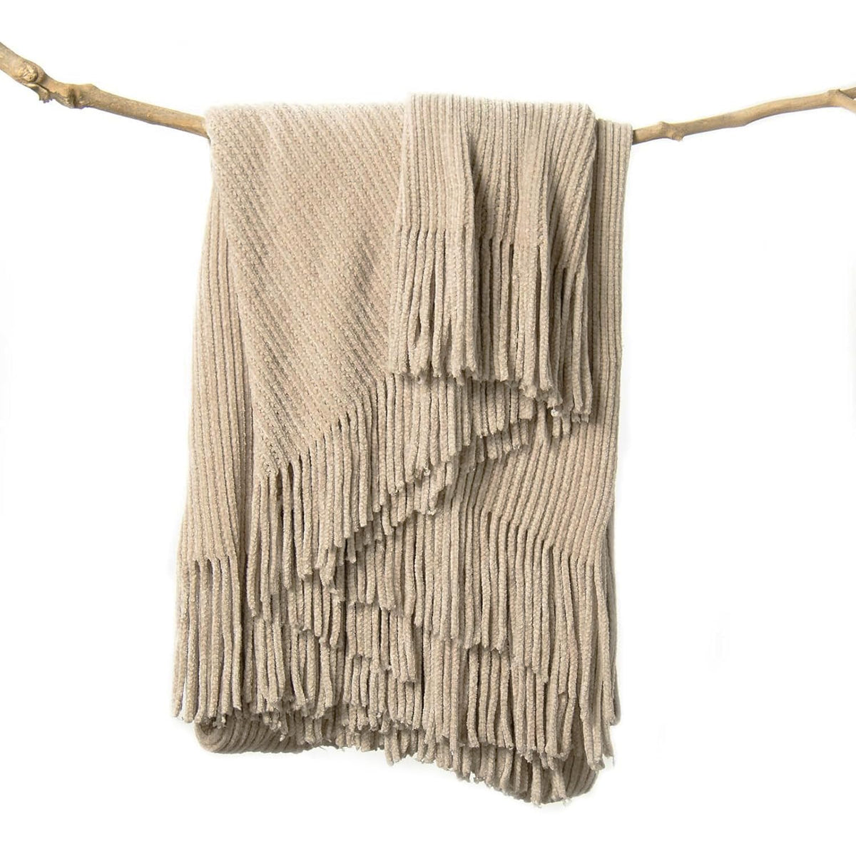 Lifein beige throw blanket on a couch adds cozy boho charm
