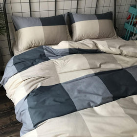 LifeTB bedroom display with modern style and plaid bedding.