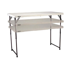 Lifetime fold-in-half table folded for compact storage