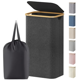 Lifewit 100L laundry basket with lid shown in a bedroom setup for tidy storage