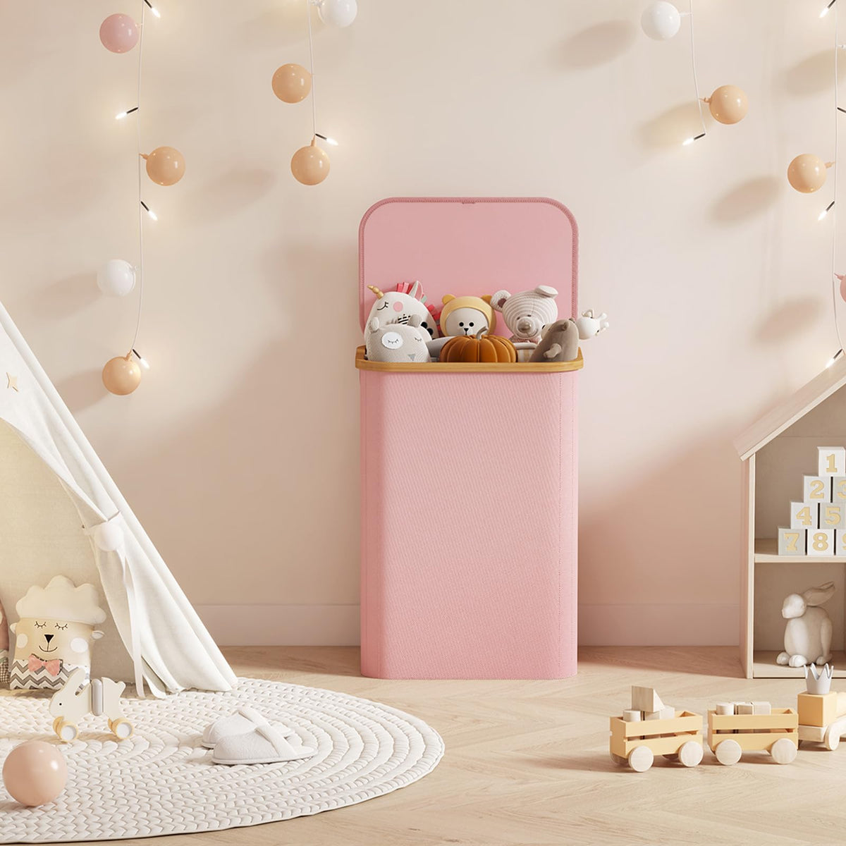 Lifewit pink laundry basket complements bedroom decor while storing laundry.