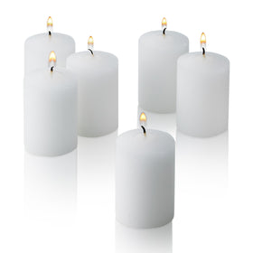 Light In The Dark white votive candles, 36-count box, ideal for tables and events.