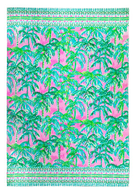Lilly Pulitzer oversized towel Suite Views pink and green on sand.