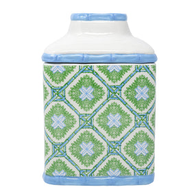 Lilly Pulitzer tissue box holder on a desk adds chic organization.