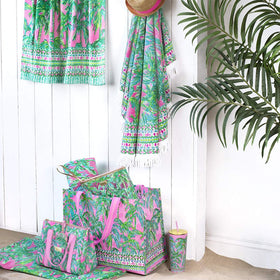 Beach setup featuring Lilly Pulitzer towel for stylish lounging.