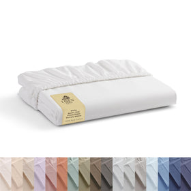 Linen Home cotton percale fitted sheet on bed showing deep-pocket fit