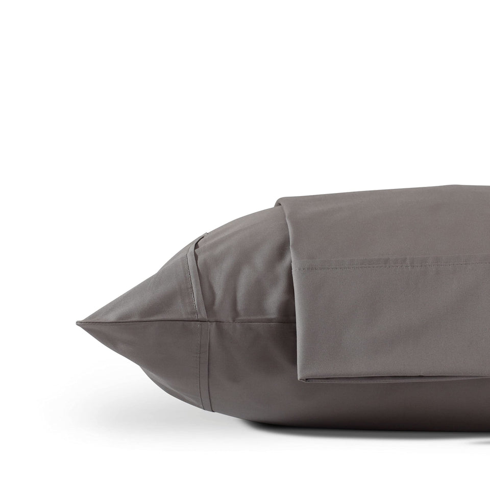 Linen Home pillowcase in charcoal with crisp percale texture for cooling nights