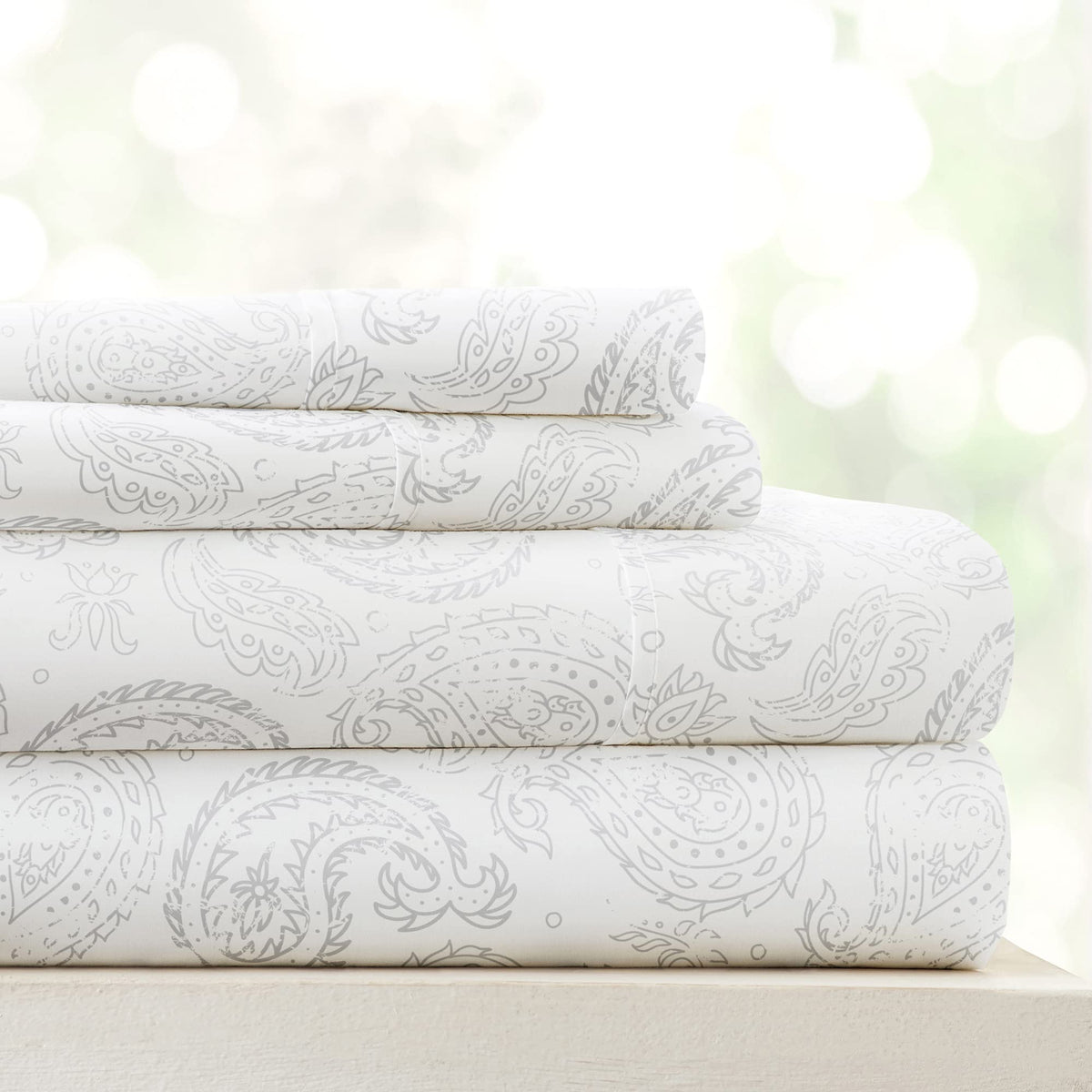 Linen Market 4 Piece Queen Sheet Set in gray floral on bed for cooling, ultra-soft sleep