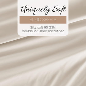 Linen Market deep-pocket sheet set on bed showcases secure tuck for thick mattresses.