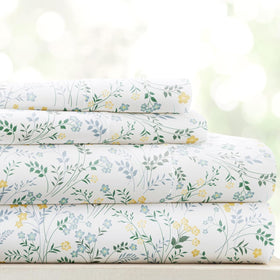 Linen Market patterned microfiber queen sheet set in wildflower light blue folded, inviting cozy aesthetic.