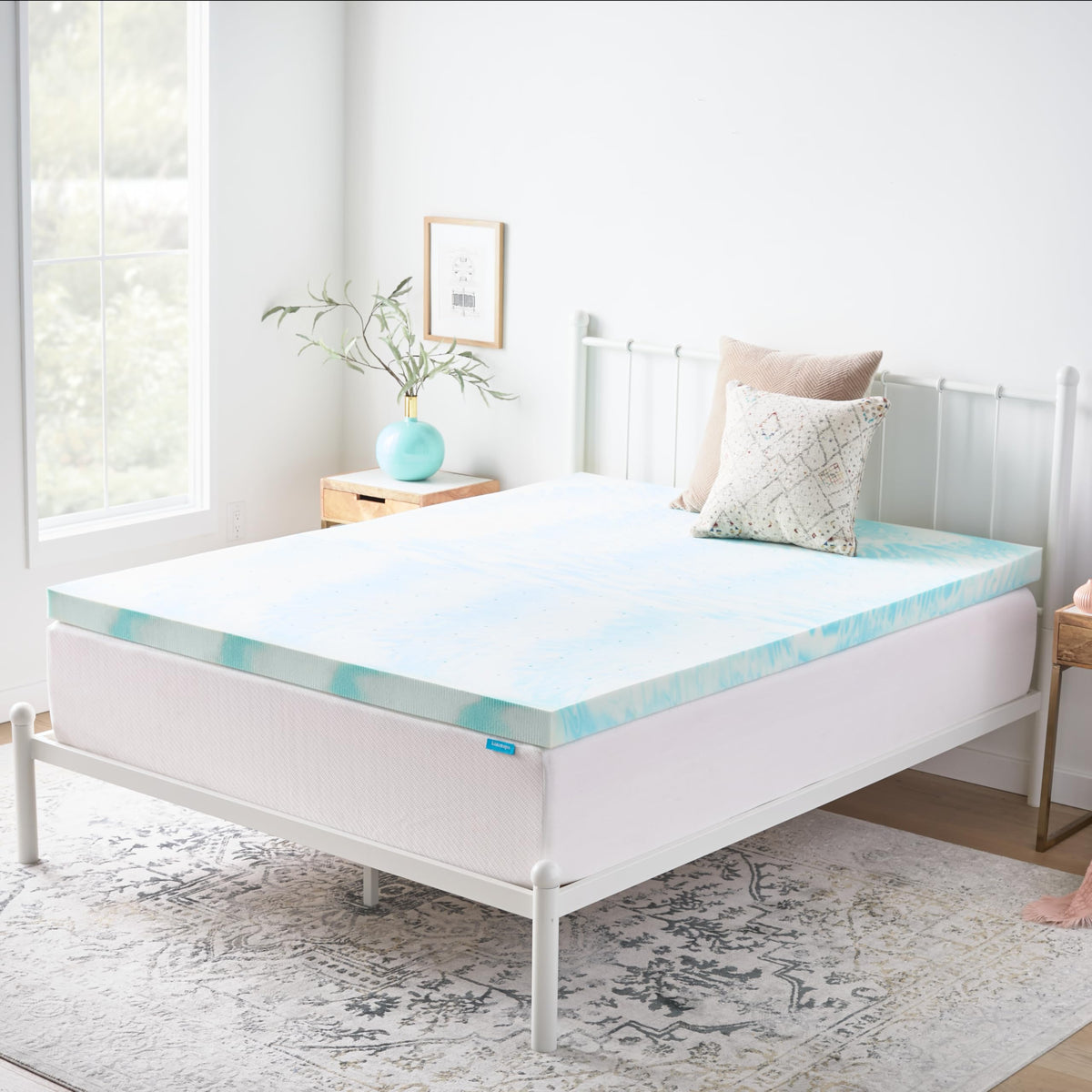Linenspa queen size topper placed on bed with standard sheets