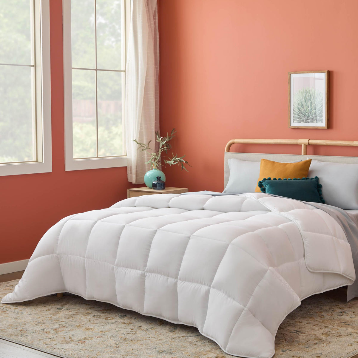 Linenspa white down-alternative comforter close-up showing plush, year-round softness.