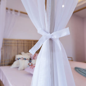 Linentalks white voile canopy curtains diffuse light with airy softness.