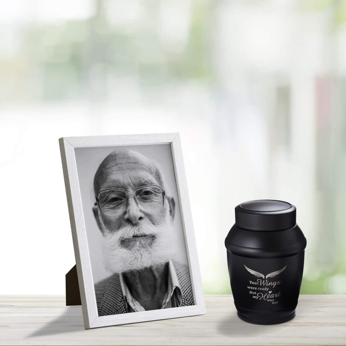 LINES ARTE sleek black urn creates a serene resting place.