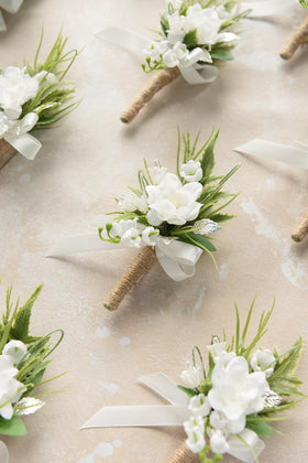 Ling's Moment 10-piece set of boutonnieres pairs with bridal bouquet for cohesive styling