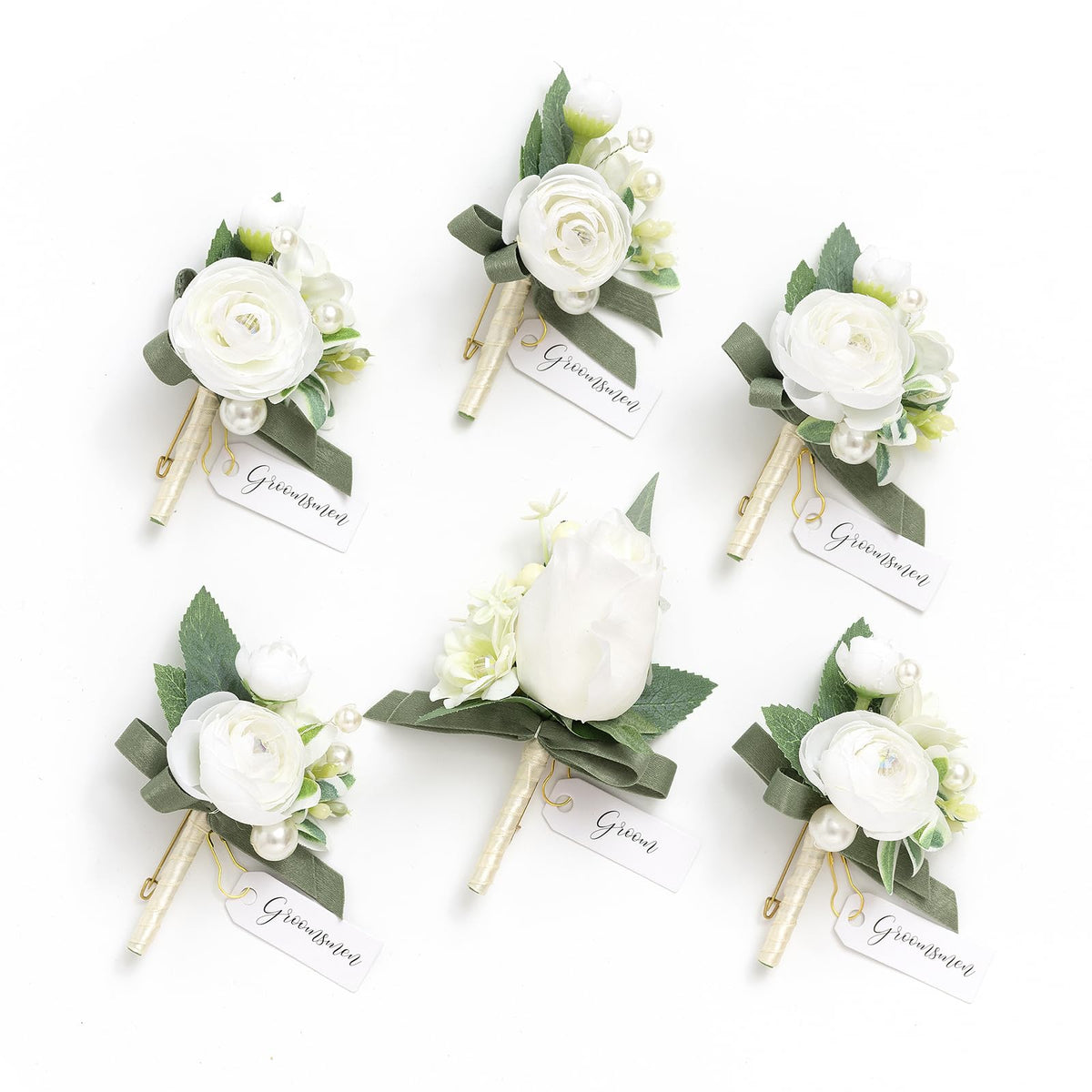 Ling's Moment boutonniere for men with ornate white ranunculus adds lasting elegance to a groom's suit