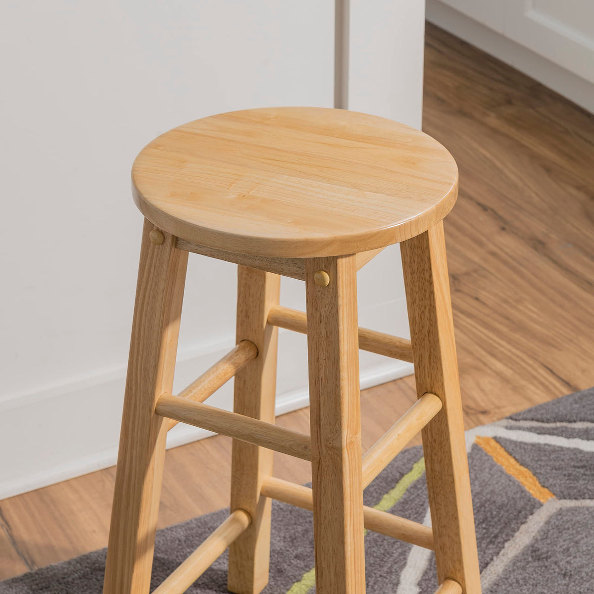 Linon barstool natural finish complements various decor styles.