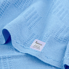 Closeup of 100% cotton weave in Linteum Textile blue blanket.