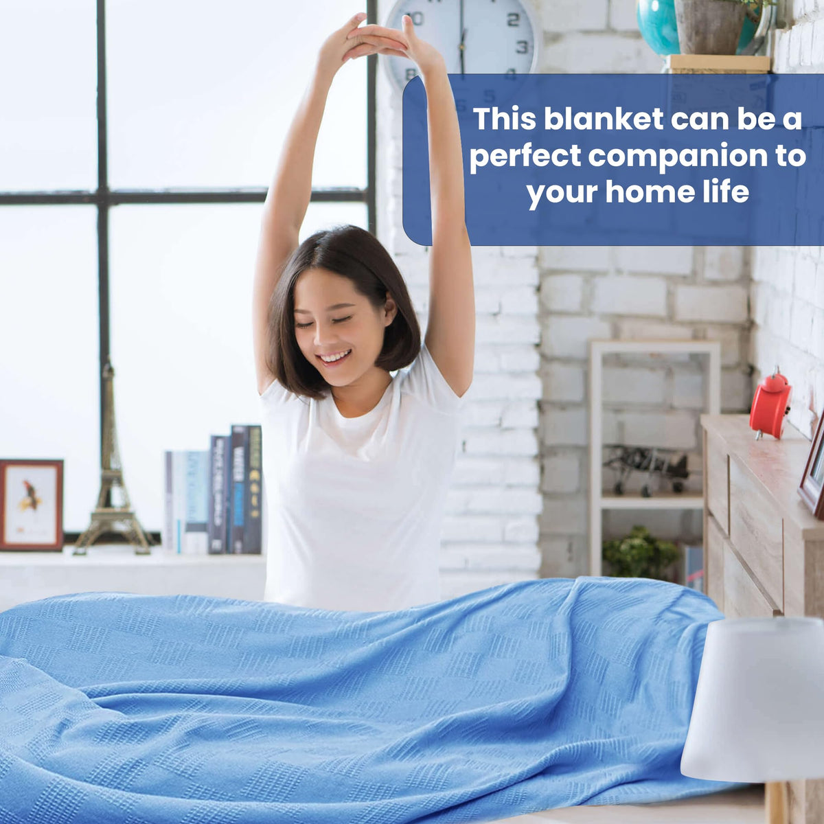 Blue bed-draped Linteum Textile blanket emphasizing warmth as a bedspread.