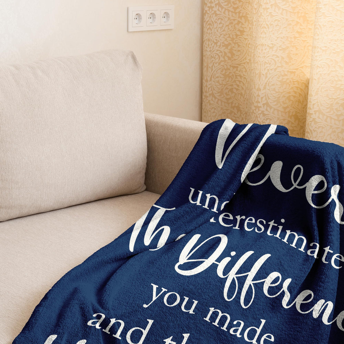 Linxher blanket draped over a sofa, a versatile cozy decor accent.
