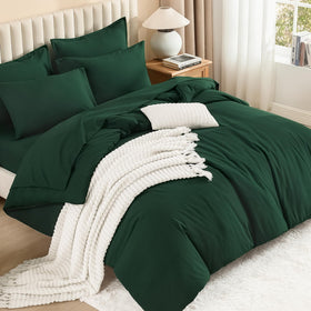 Litanika dark emerald green comforter set closeup, rich color and soft fabric texture.