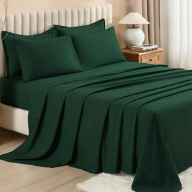 Litanika queen comforter set styled in a modern emerald bedroom