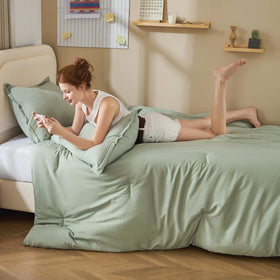 Litanika twin XL comforter set sage green on bed for cozy year-round warmth.