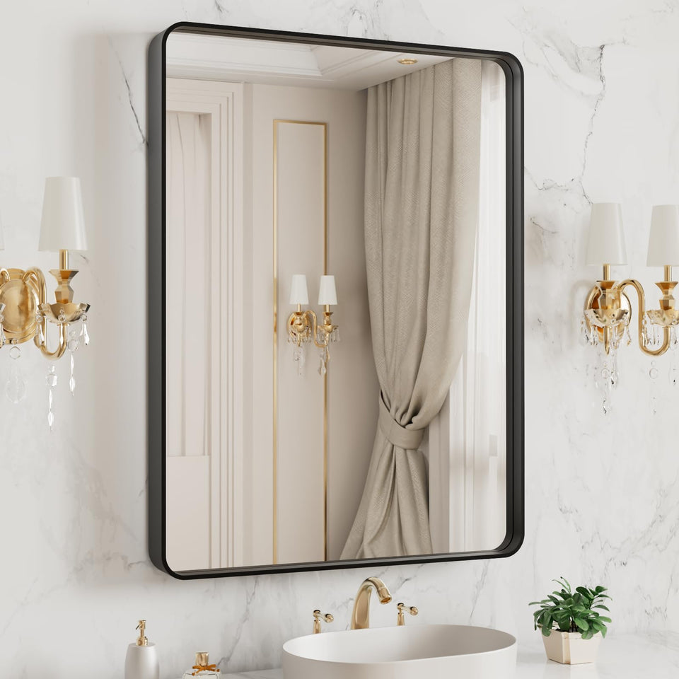 LOAAO bathroom mirror with black metal frame and rounded rectangle silhouette.
