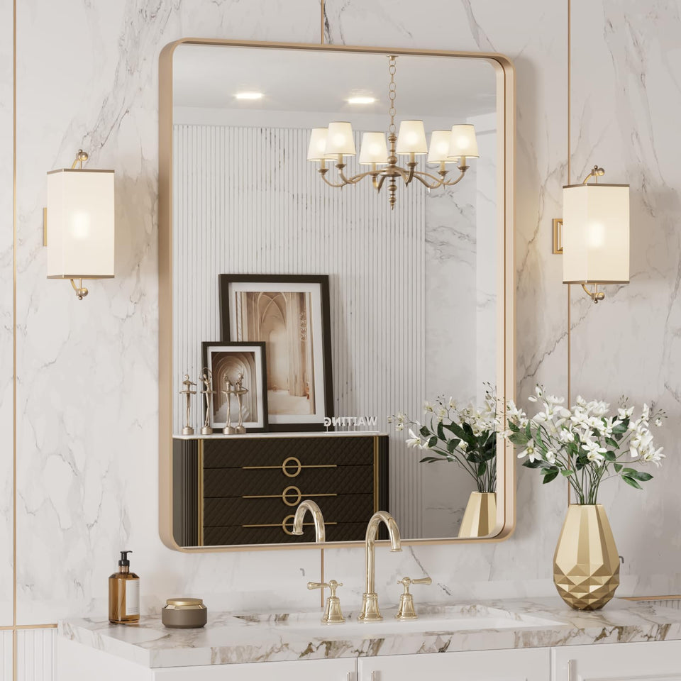 LOAAO 24x32 gold mirror with rounded rectangle frame enriching a modern bathroom space