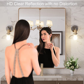 LOAAO brushed gold frame mirror adds warm elegance to contemporary bathrooms.