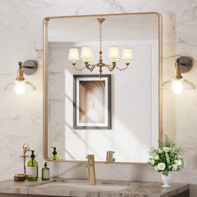 LOAAO luxury gold mirror adds warmth and ambience to a room.
