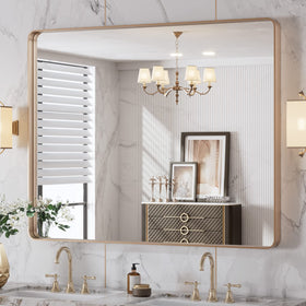 LOAAO rounded-rectangle gold mirror enhances vanity with warm, clear reflection