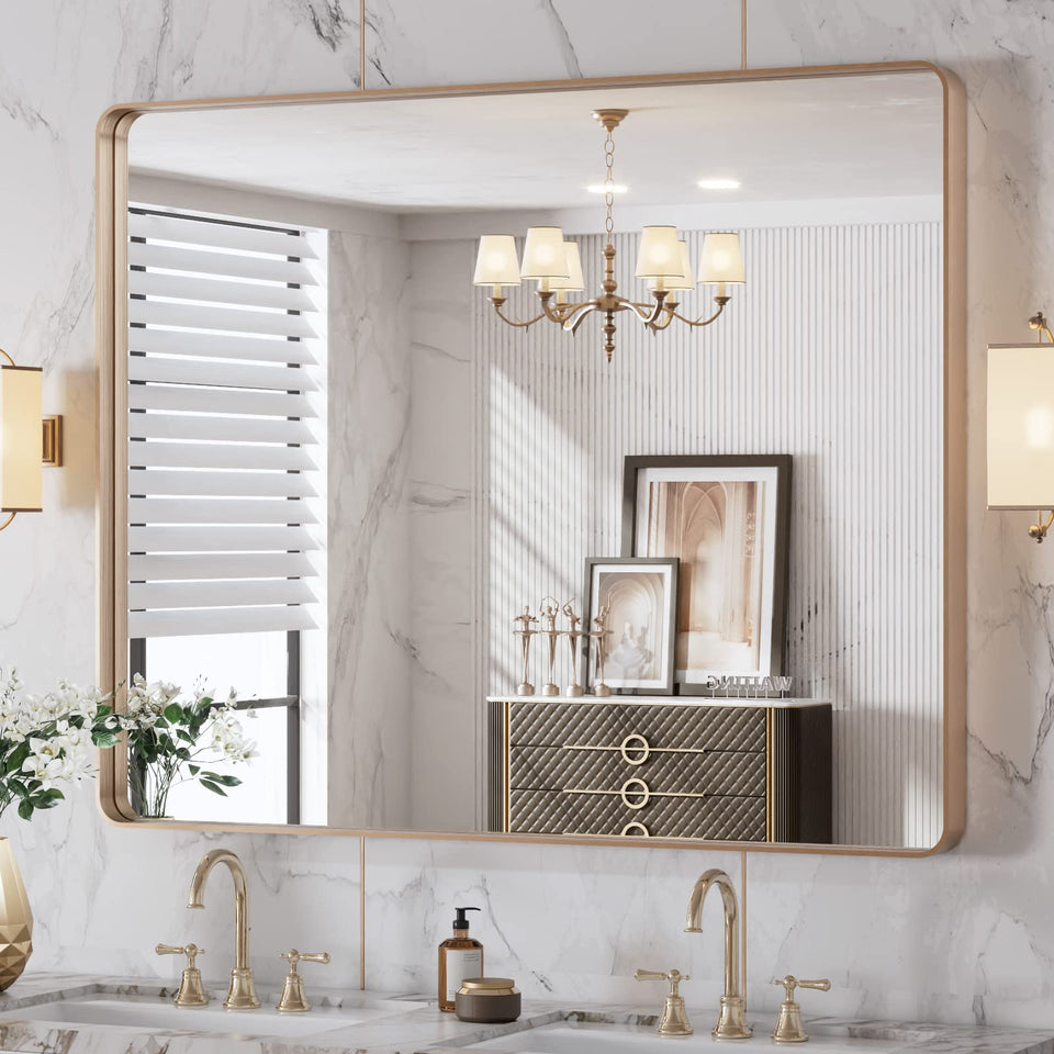LOAAO rounded-rectangle gold mirror enhances vanity with warm, clear reflection