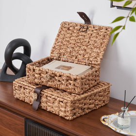 LOHONER leather strap closure detail adds refined finish to stylish storage.